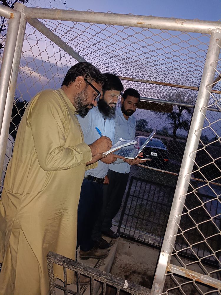 Company Overview xWIT engineers verifying canal water level data at a telemetry station in Khanewal, Punjab